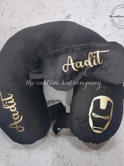Travel in superhero style with this Iron Man-themed travel set. The all-black collection includes a personalized neck pillow, eye mask, and a foldable travel pillow for ultimate comfort.