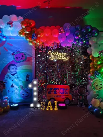 Another angle of the Cocomelon party with a sequin wall.
