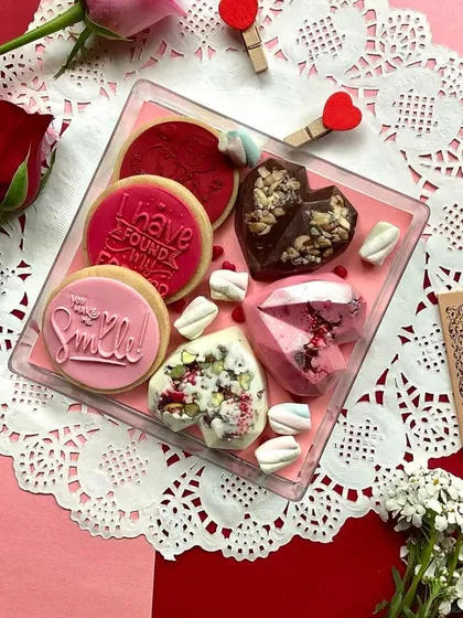 Treat your Valentine to something truly delightful. This platter includes our message cookies and geometric smash hearts filled with surprises.