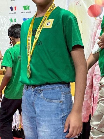 A student proudly wearing his winner's medal at the Brainobrainfest. Every participant is recognized for their effort, fostering a positive and encouraging competitive spirit.