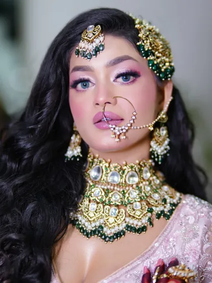 A close-up of the festive Eid makeup. The pop of color on the eyes is balanced with a soft pink lip.