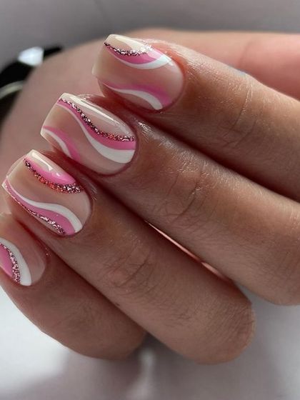 Pink and white swirls with a line of pink glitter for extra sparkle. This is a fun and feminine take on the abstract swirl trend.