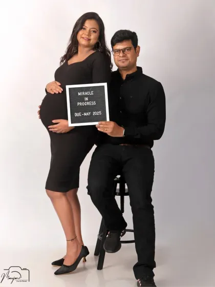 A classic black and white portrait of the couple, announcing their due date. The simplicity of the style puts all the focus on their joy and connection.