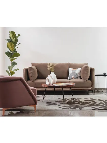 The full setup of the living area, showing how we use plants and carefully selected decor to create a space that is minimal yet warm and inviting.