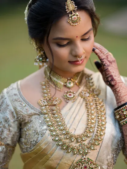 A serene portrait with eyes gently closed, highlighting the soft and subtle eye makeup.