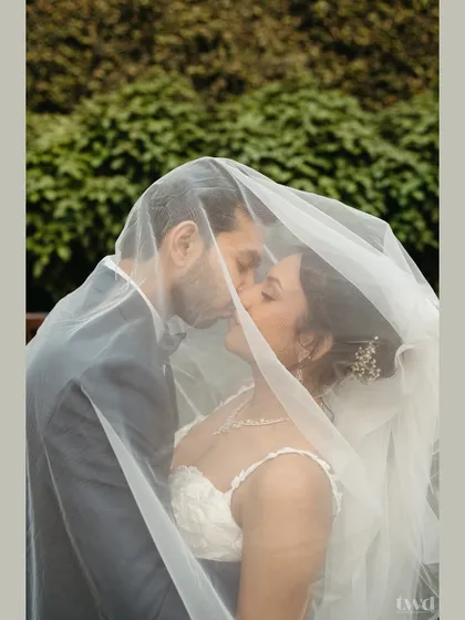 Some moments are so tender they need to be whispered. Sheltered beneath the veil, this quiet kiss during a beautiful Catholic garden wedding is a perfect example of the intimate, soulful memories I promise to capture for you.