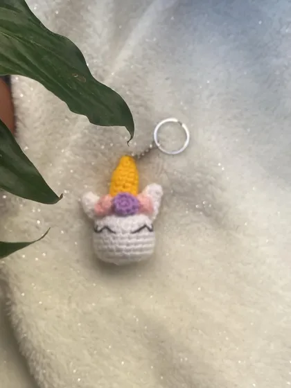 Another shot of the unicorn keychain against a soft, glittery background. These make wonderful party favors or small gifts for anyone who loves fantasy.