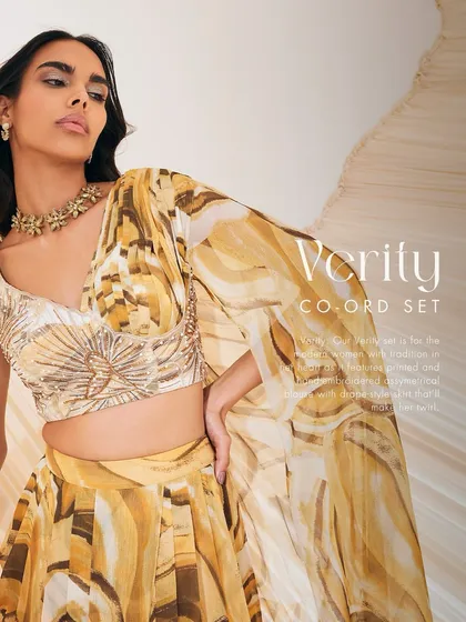 A close-up of the Verity co-ord set in a yellow print, highlighting the hand-embroidered asymmetrical blouse.