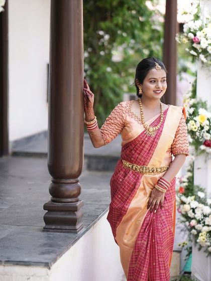 A full-length shot of Divya's look. The makeup and hairstyle are designed to be elegant and understated, perfect for a daytime event.