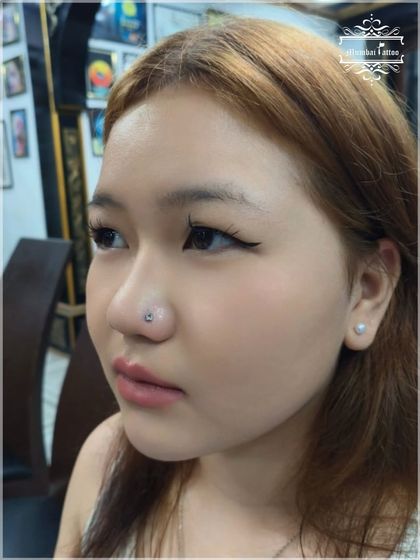 A simple and elegant nose stud can completely change your look. This piercing was done safely and hygienically by our expert piercers.