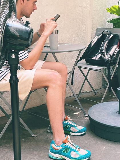 A quiet moment of work and relaxation in our outdoor seating area. We provide the fan, you bring the focus.