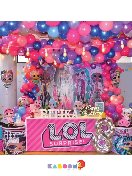 Get ready for a surprise! This L.O.L. Surprise! theme is filled with bright pinks and blues, featuring all the popular dolls and a bold, glittery setup for an eighth birthday.