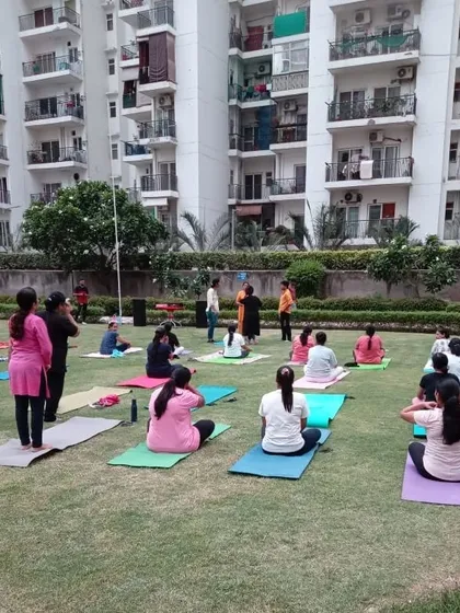 Participants settling into their practice during our community yoga event. We welcome everyone, from beginners to experienced yogis, to join our sessions.