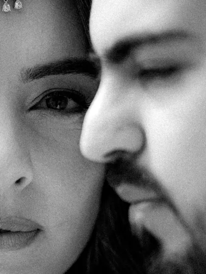 An intensely close and personal black and white portrait. This frame is about the space between, the unspoken connection that is so powerful. It’s a testament to my documentary approach, getting close to the heart of the moment.