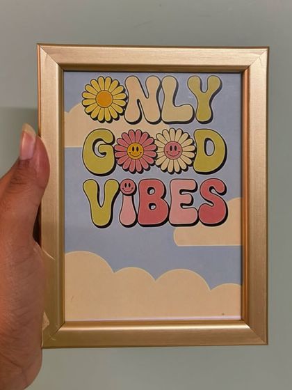 Match your decor with a frame that fits your vibe. This "Only Good Vibes" frame features a retro 70s aesthetic with cheerful colors, all housed in a stylish golden foil frame.