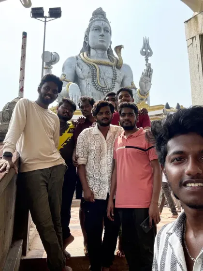 A selfie with the boys in front of the world's second-tallest Shiva statue at Murudeshwara. This is a key highlight of our coastal Karnataka tour.