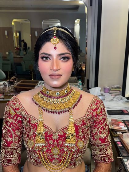 A close-up of the bride's makeup, showing the clean lines and flawless application. The focus is on creating a look that is both beautiful in person and stunning on camera.