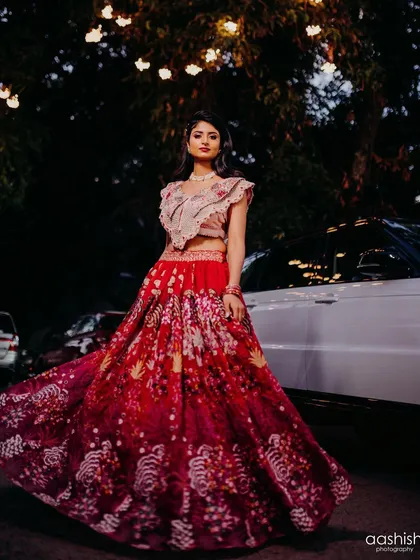 Another artistic shot of the bride and her flowing lehenga. The makeup is strong enough to stand out even in a wide shot.