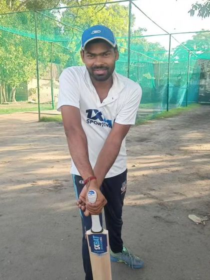 A player ready for his net session with his bat. We ensure our players are well-equipped for every practice.