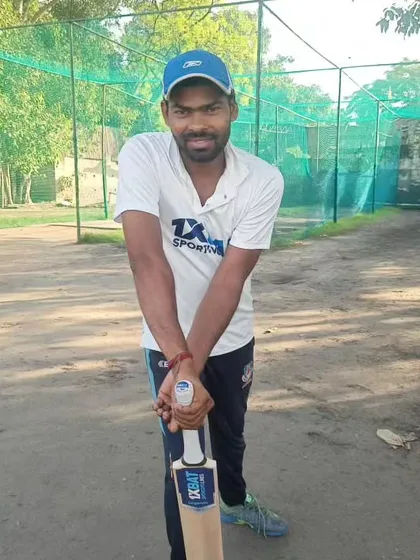 A player ready for his net session with his bat. We ensure our players are well-equipped for every practice.