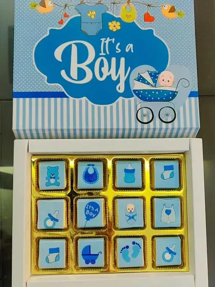 At the heart of my business are my handmade chocolates. This 'It's a Boy' announcement box features chocolates with custom wrappers, offering a simple, sweet, and elegant way to share your happy news with family and friends.