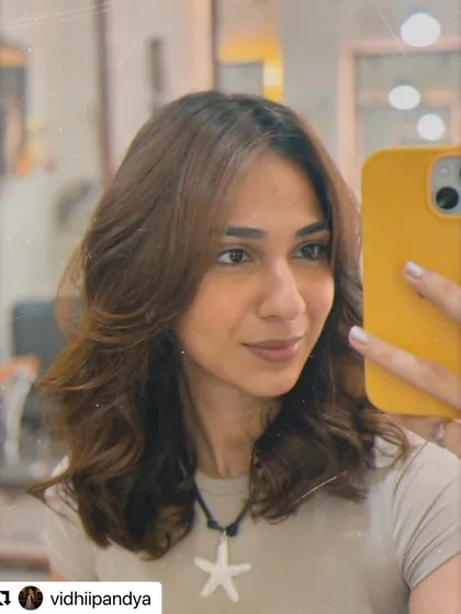 A selfie from Vidhii Pandya showing off her fresh cut. The face-framing layers and gentle styling give her hair a healthy, effortless appearance.