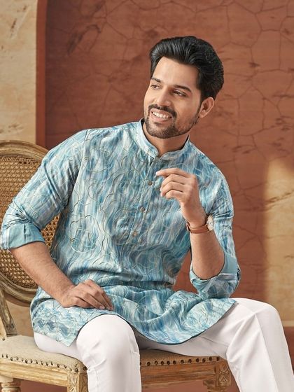 This abstract-print blue kurta, featured in our Diwali campaign, offers a cool and contemporary option for your festive wardrobe.