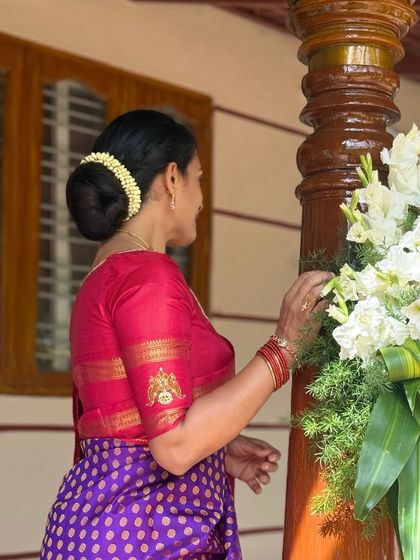 A side profile of a client wearing my signature jewellery concept blouse. The placement of the motif on the sleeve is designed to be visible and add a special touch to the overall look.