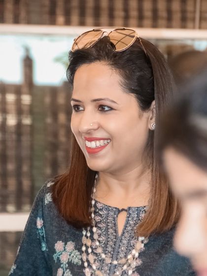 A candid shot of a guest smiling during a conversation. My goal is to capture the genuine happiness of your event.