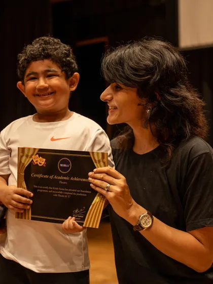 A proud moment as a student receives his certificate of achievement. Positive reinforcement is a key part of our teaching philosophy.