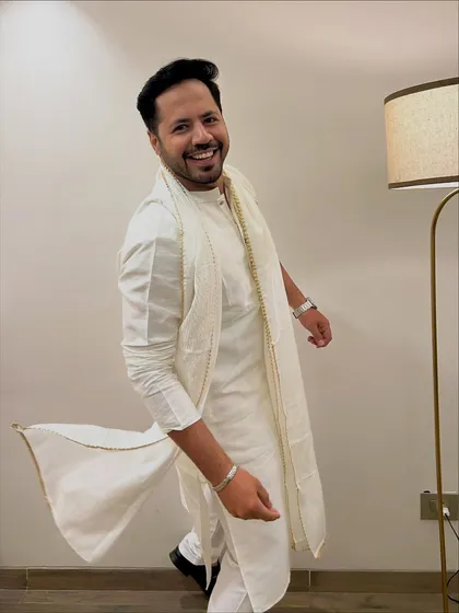 A dynamic shot, showing the flow of the kurta. Even in traditional wear, there's always energy.