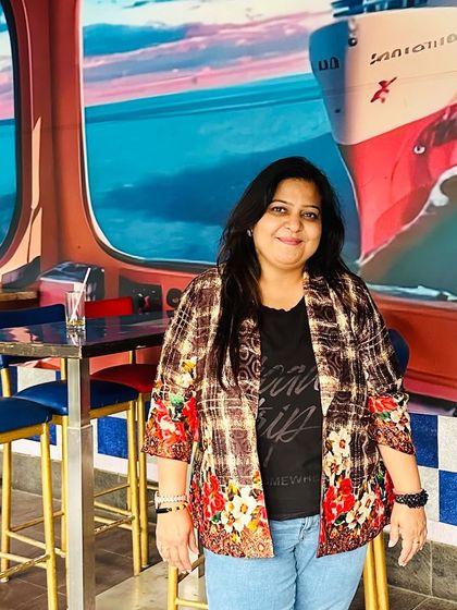 A custom blazer can elevate any outfit. This piece, with its unique floral and plaid print, is versatile enough to be worn over a t-shirt and jeans for a casual look or paired with formal trousers for a more dressed-up occasion.