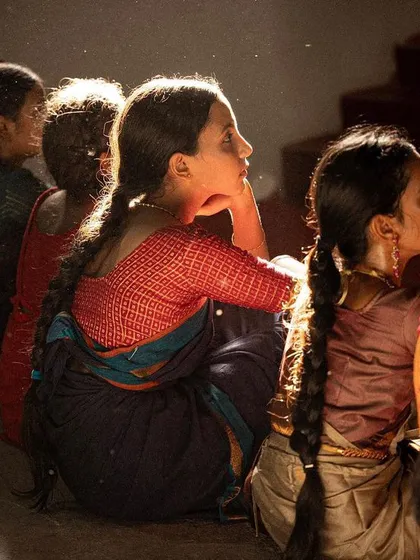The heart of learning is in the listening and observing. This moment captures the deep concentration and emotional connection, or Bhava, of students as they absorb the details of a lesson.