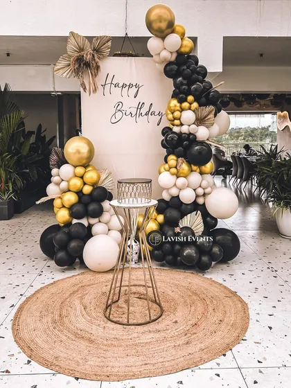 This black, white, and gold boho decor is perfect for a stylish indoor event.