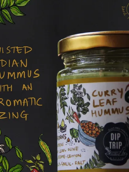 A product shot of my Twisted Indian Hummus jar. The label hints at the aromatic zing of curry leaf inside, a unique fusion that sets my hummus apart.