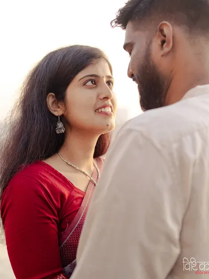 The quiet moments are often the most powerful. This is a candid close-up portrait, focusing on the gentle look shared between the couple during their pre-wedding session in Mumbai.