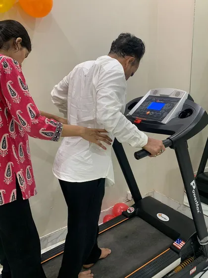 I believe in providing hands-on support throughout your recovery. Here, I am assisting a patient with guided walking on a treadmill, a crucial step in rebuilding strength and coordination after a neurological event like a stroke.