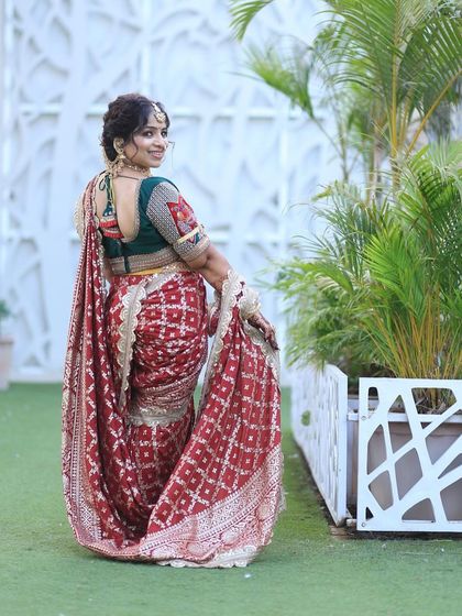 The same happy customer showing the back of the outfit, with the beautiful blouse and hairstyle.