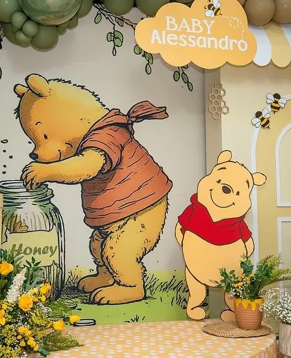 A close up of the main characters on the Winnie the Pooh backdrop.