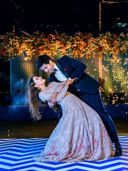 Capturing the peak energy of a Sangeet night. This shot of the couple's first dance, complete with sparklers, showcases our ability to photograph dynamic moments in low-light conditions to create spectacular, memorable images.