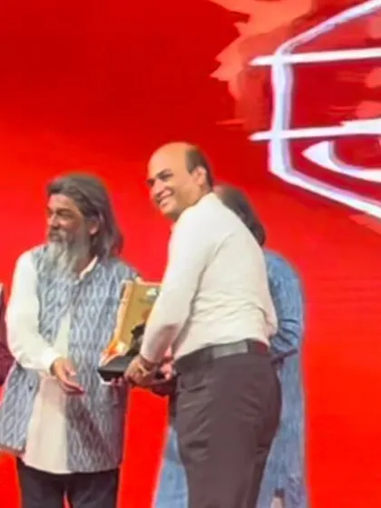 Receiving an award from the legendary art director Shri Nitin Desai on stage. His passing is a great loss to the art world.