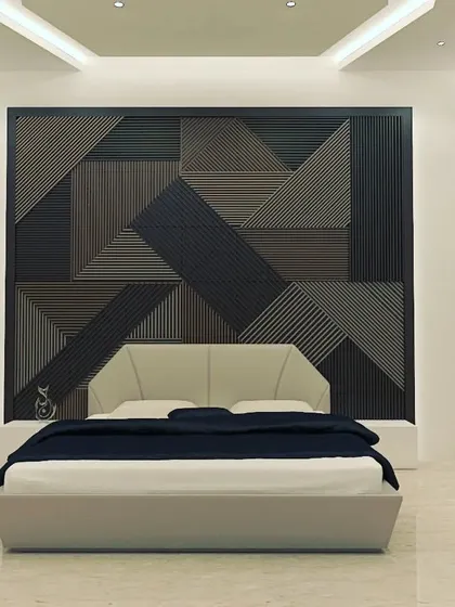 A 3D render of a contemporary bedroom design. The focus here is on creating a serene and sophisticated atmosphere through a geometric feature wall, minimalist furniture, and carefully planned ambient and accent lighting, showing our attention to detail in private living spaces.