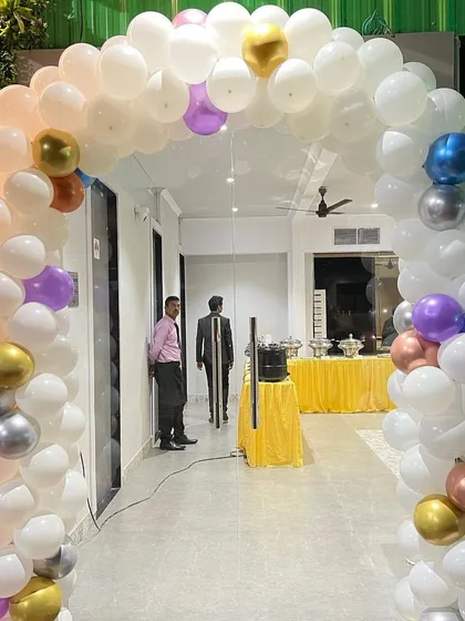 Another view of the entrance balloon arch, showing how it frames the doorway and sets a celebratory tone right from the moment guests arrive.