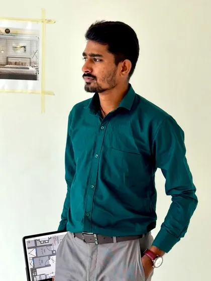 Holding a tablet with the floor plan on-site. This helps in explaining the layout and flow of the space to the clients and execution team.