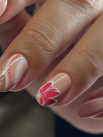 A close-up of the delicate pink flower and dotted line art.