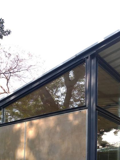 The Gazebo 1.0 project in New Delhi, a lightweight and modular steel structure designed as an office. The warm wooden interiors and textured surfaces provide a balance to the industrial efficiency of the knockdown steel and glass frame.