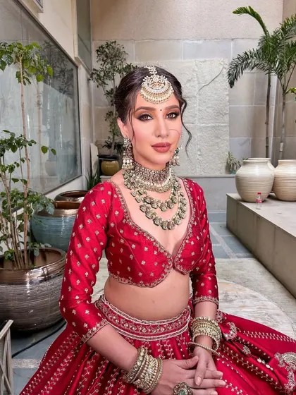 A beautiful portrait of the bride, ready for her big day. The styling is a perfect blend of tradition and modern elegance.