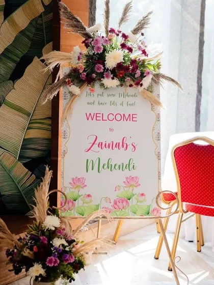 A personalized welcome sign for Zainah's Mehendi. I decorated the easel with a floral arrangement of pampas grass and fresh flowers to match the event's overall aesthetic.