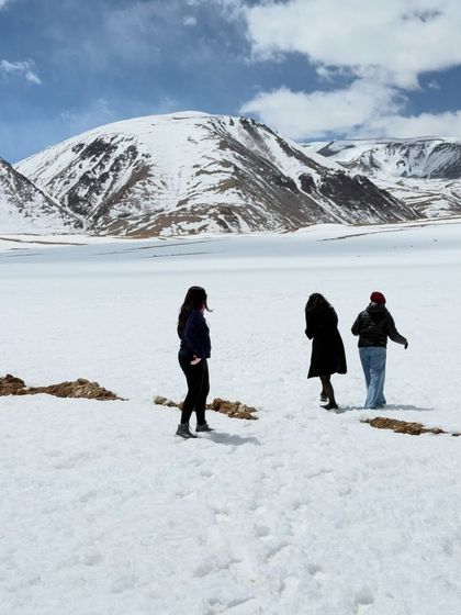 Friends enjoying the snow in Ladakh. I plan trips that allow for spontaneous fun, whether it's a snowball fight or just enjoying the winter scenery.