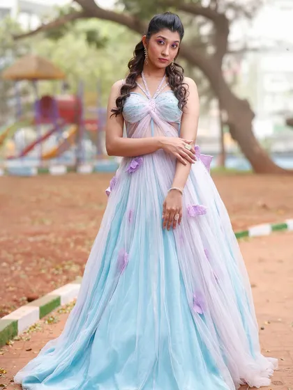 Another full-length pose, showing the flow and elegance of the gown.